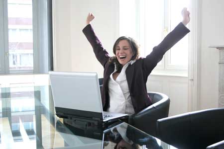 Business woman celebrating improved email response rates